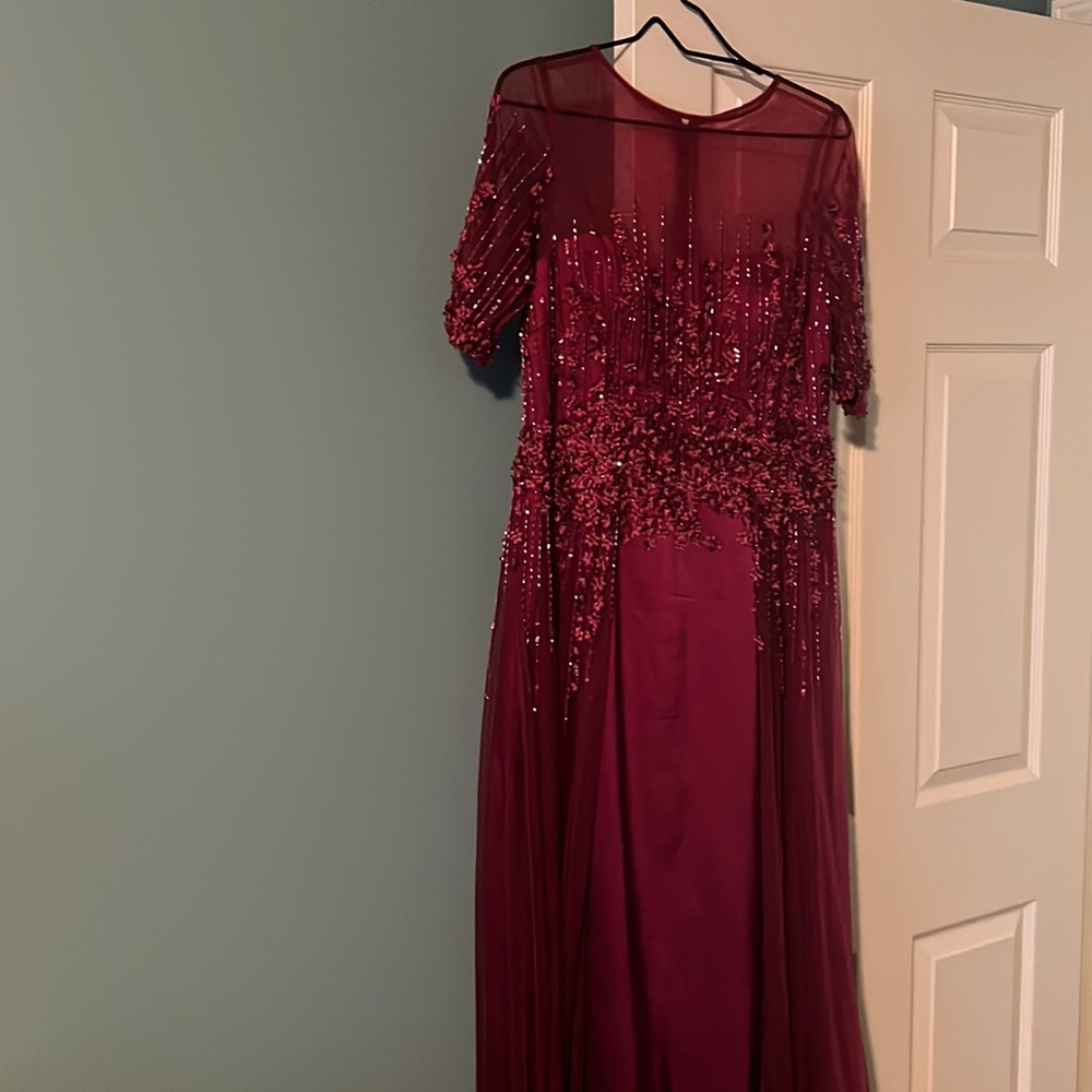 Long beautiful designer gown in a gorgeous dark wine color.
